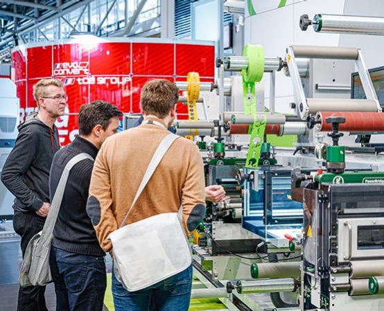 Visitors looking at a product stand at ICE Europe