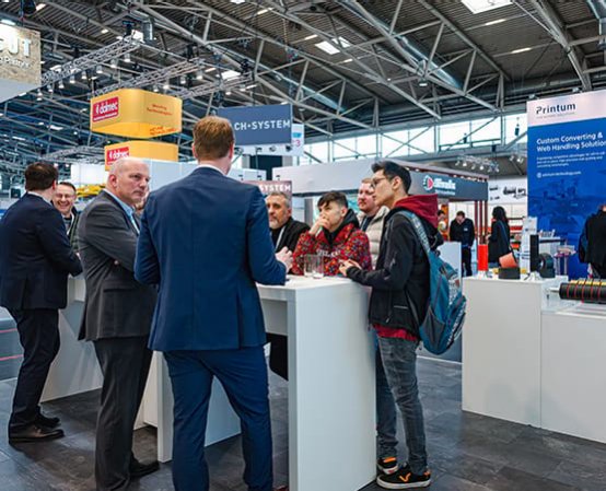 Exhibitors and visitors meet on a stand at ICE Europe