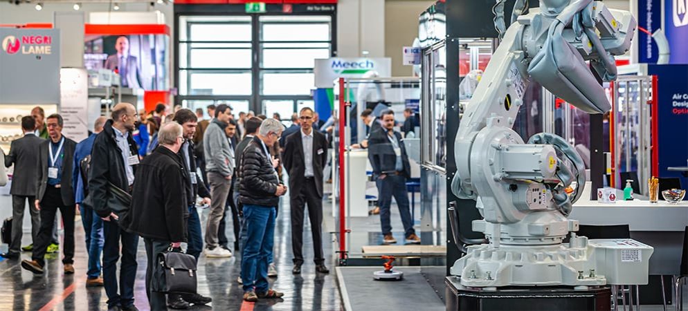 Exhibitors and visitors looking at a product stand at ICE Europe